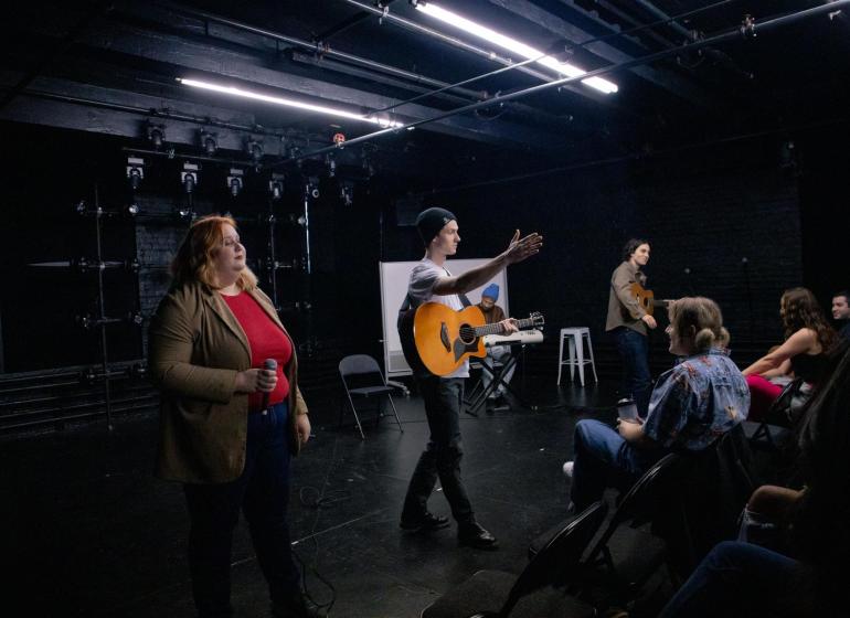Students performing on stage