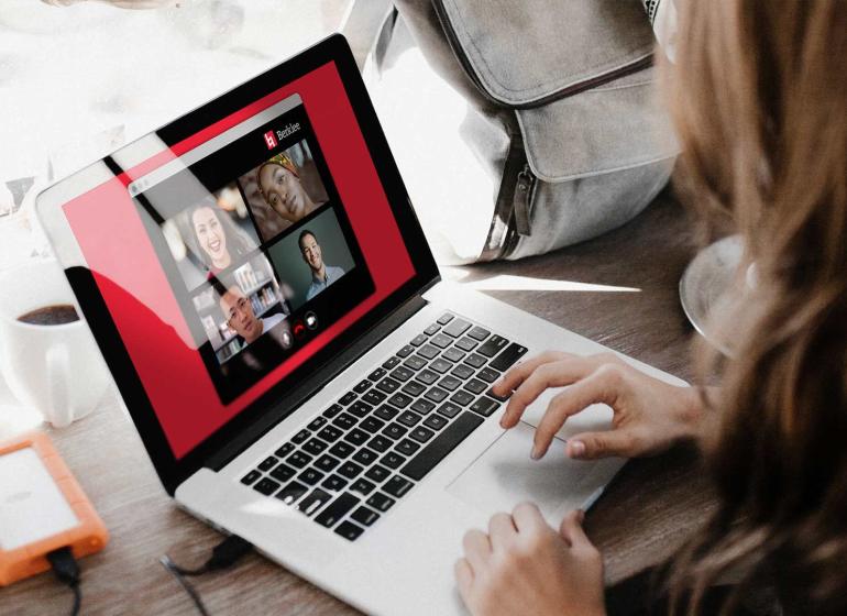 Woman in the music business conducting a meeting online.