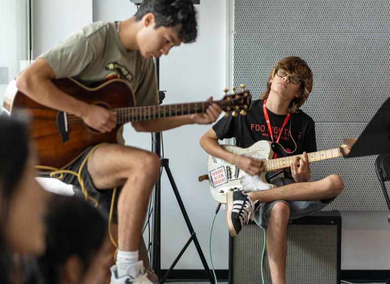 Youths in the classroom, studying in the Contemporary Arts and Music Program at the Berklee Valencia campus.