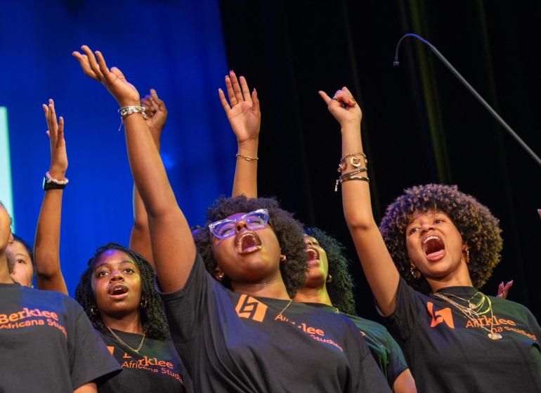 Students performing on stage