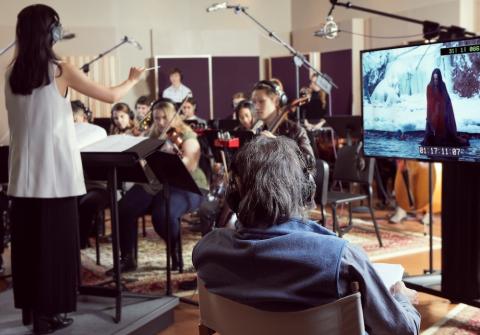 students scoring a film