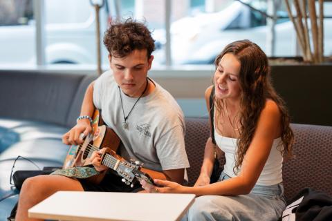 Two students work on a song together